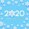 New Year concept - 2020 numbers on blue background with paper snowflakes for winter holidays design