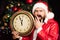 New year concept. Time. New Year`s Eve night. Santa Claus is holding a clock. Five minutes before the new year. Chimes