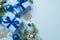 New Year concept. Top view photo of gift boxes with bows blue and silver baubles snowflake ornaments fir branches in snow and