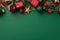 New Year concept. Top view photo of red gift boxes with green ribbon bows baubles gold star ornaments mistletoe berries and pine