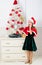 New year countdown. Girl kid santa hat costume with clock counting time to new year. How much time before. Last minute