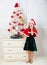New year countdown. Girl kid santa hat costume with clock excited happy face counting time to new year. Last minute new