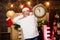 New year countdown. Merry christmas. Time for miracles. Few minutes left. Woman Santa hat hold vintage clock. Time for