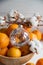 New Year decoration: orange mandarins, Christmas tree toy and cotton