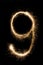 New year font sparkler number nine on black background