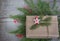 New year gift box handicraft wrapping, parchment, twine fir tree twigs, cute simple last minute present handmade. Christmas