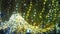 New Year glowing golden garlands hang over Christmas tree. Outdoor winter decoration. Festive design of city square