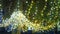 New Year glowing golden garlands hang over Christmas tree. Outdoor winter decoration. Festive design of city square