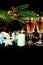 New Year holiday concept. New Year\\\'s decor - champagne glasses, Christmas toys, a Christmas tree with decorations, a candle for