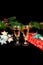 New Year holiday concept. New Year\\`s decor - champagne glasses, a gift, New Year\\`s toys, a Christmas tree with decorations