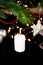 New Year holiday concept. New Year\\\'s decor - champagne glasses, New Year\\\'s toys, a Christmas tree with decorations, a candle is