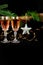 New Year holiday concept. New Year`s decor - champagne glasses, New Year`s toys, a Christmas tree with decorations. Place for an