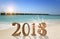 New Year inscription 2018 in the sand on the beach