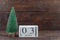 New Year. January 3 on the calendar. Calendar with a small Christmas tree on a wooden background. Winter