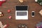 New Year. Laptop smartphone and gifts isolated on wooden surface top view close-up