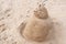 New Year or Merry Christmas sand snowman on ocean beach