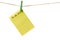 New Year New Goals. Yellow Sticky Note Paper on a clothesline isolated on white. To do list