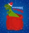 New year Paleontologists . Dinosaur T- rex in red sack Santa Claus. Tyrannosaurus congratulates on Christmas. Prehistoric