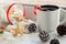 New year preparation concept. Christmass background with ginger bread, cup of coffee, red christmas csndy cane, cones, marshmallow