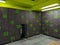 New Year resolution to go to the gym with a view of a modern locker room in grey and green colors with one locker open ready for a