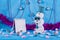 New Year`s adventures of cheerful snowmen on a blue stage