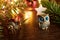New Year's or Christmas composition with souvenir figures of owl and snail next to fir-tree, cinnamon sticks and