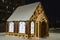 New Year\\\'s, Christmas gingerbread decorative house, decorated with luminous patterns and garlands. Festive winter cit