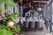 New Year\\\'s Christmas interior veranda modern restaurant setting, serving banquet, gray textile chairs, serving tables, wine glass
