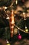New Year\\\'s colorful toys and garland hang on a natural Christmas tree. Close-up and soft focus, Christmas background