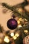 New Year\\\'s colorful toys and garland hang on a natural Christmas tree. Close-up and soft focus, New Year background