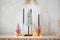 New Year's composition of candles, Christmas trees, garlands on fireplace