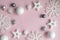 New Year's composition. Christmas pink and white decorations on a pastel pink background. Layout of a postcar