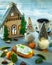 New year`s composition with a festive house, gingerbread and tangerines with leaves, filmed at close range