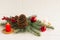 New Year`s composition to decorate the festive house and table. spruce branches, a branch with berries, a candle, balls and a con