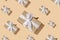 New Year`s composition. Trendy New Year pattern of gift boxes in paper with a white ribbon with a hard shadow on a sand-colored