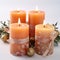 New Year\\\'s decor with candles and Christmas decorations in apricot crush color. Jewelry in delicate shades for the holiday