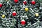 New Year\\\'s decoration balls on a snowy branch. Christmas tree toy on the branches of spruce covered with snow. Blue shiny balloon