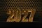 New Year`s Eve hive with bee on honey comb  Shiny hexagonal gold number 2027 on a black background with bee