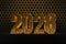 New Year`s Eve hive with bee on honey comb  Shiny hexagonal gold number 2028 on a black background with bee