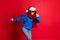 New year`s eve party concept. Photo portrait festive girl dancing wearing eye-glasses scarf santa hat blue pullover