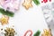 New year`s Flatley on a white background, boxes with gifts of berries, sweets and branches of a coniferous tree around the
