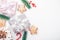 New year`s Flatley on a white background, boxes with gifts of berries, sweets and branches of a coniferous tree on the edge of th