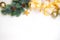 New Year`s gifts with a golden bow, a fir branch on a light background. Flat lay, top view, copy space for text. Christmas festiv