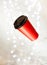 New Year`s lighting bokeh, red paper cup for coffee flying