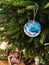 New Year`s morning. Bunch of presents under Christmas tree. Gifts to open. Blue Christmas tree ball.