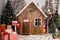 New Year`s photo zone with snow near a wooden toy house