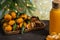 New Year`s tangerines with leaves on a wooden tray with spices star anise and cinnamon and tangerine juice on the background of