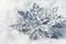 New Year`s toy silvery snowflake in the snow,