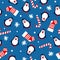 New year seamless background with penguins, christmas socks, candy cane and snowflakes on a blue background