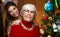 New year. senior grandma and young caucasian woman, teenager near christmas tree. granddaughter, teen hugging, embraces